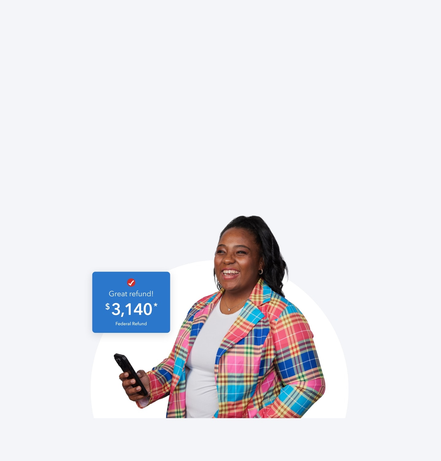 A woman is smiling and excited while using her phone to look at her federal refund she’s getting with TurboTax's help.