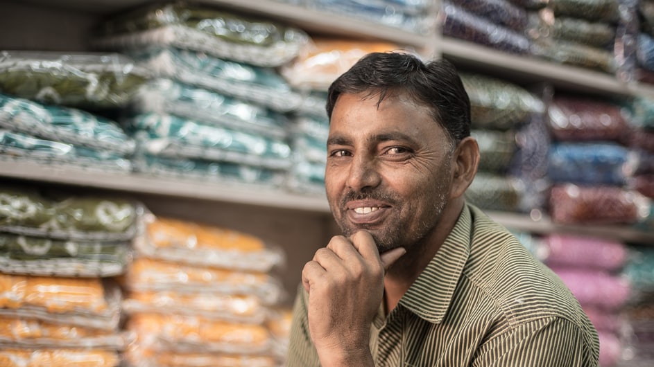 Man smiling in a warehouse