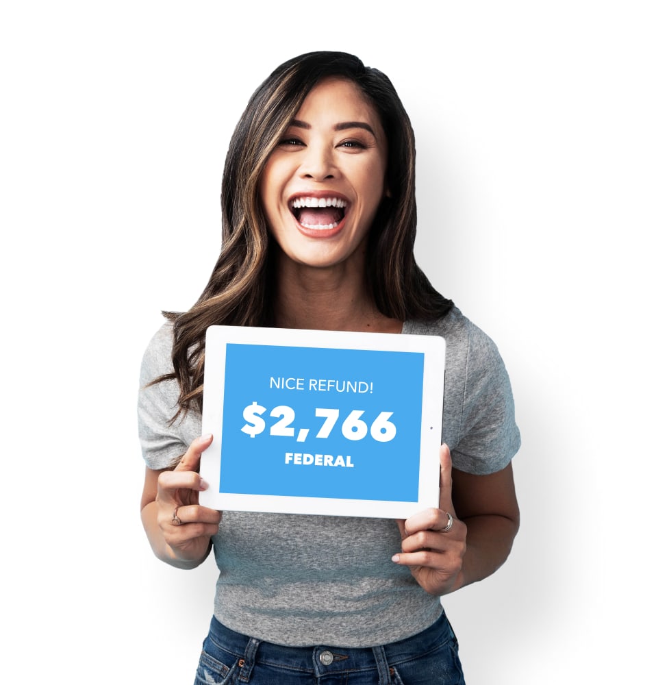 A woman is smiling and excited while looking at her federal refund she's getting with TurboTax's help.