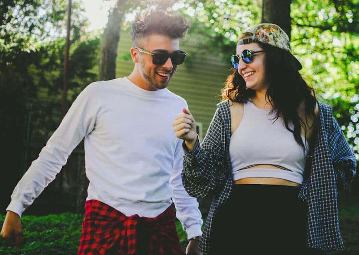 A young man and a young woman having fun outdoors