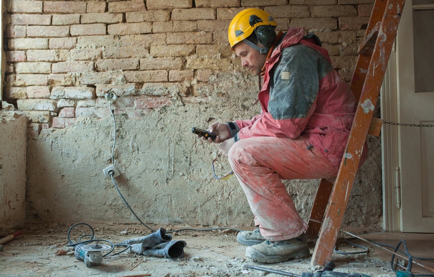 A construction worker taking a break on site