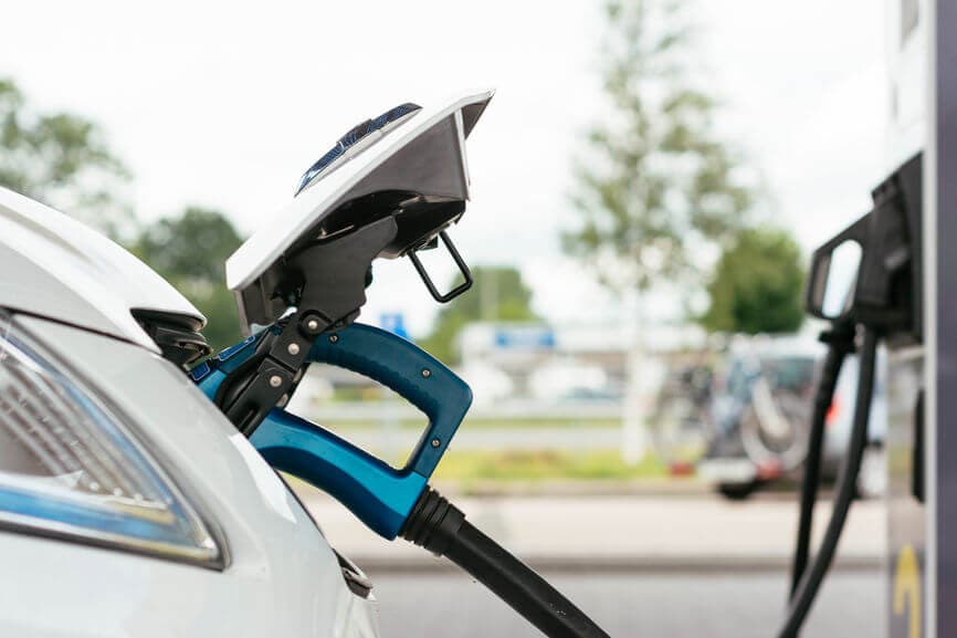 electric car at a gas station