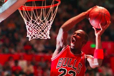 Michael Jordan dunking basketball