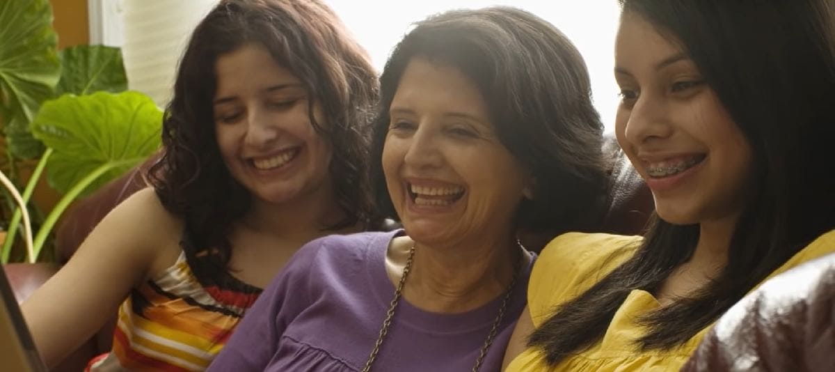 multigenerational female family members laughing together