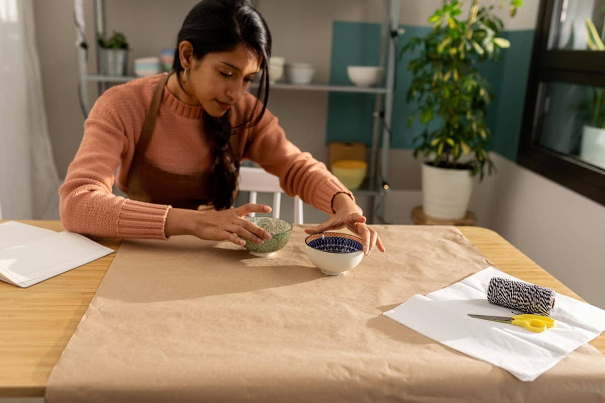  female fashion designer working at table 