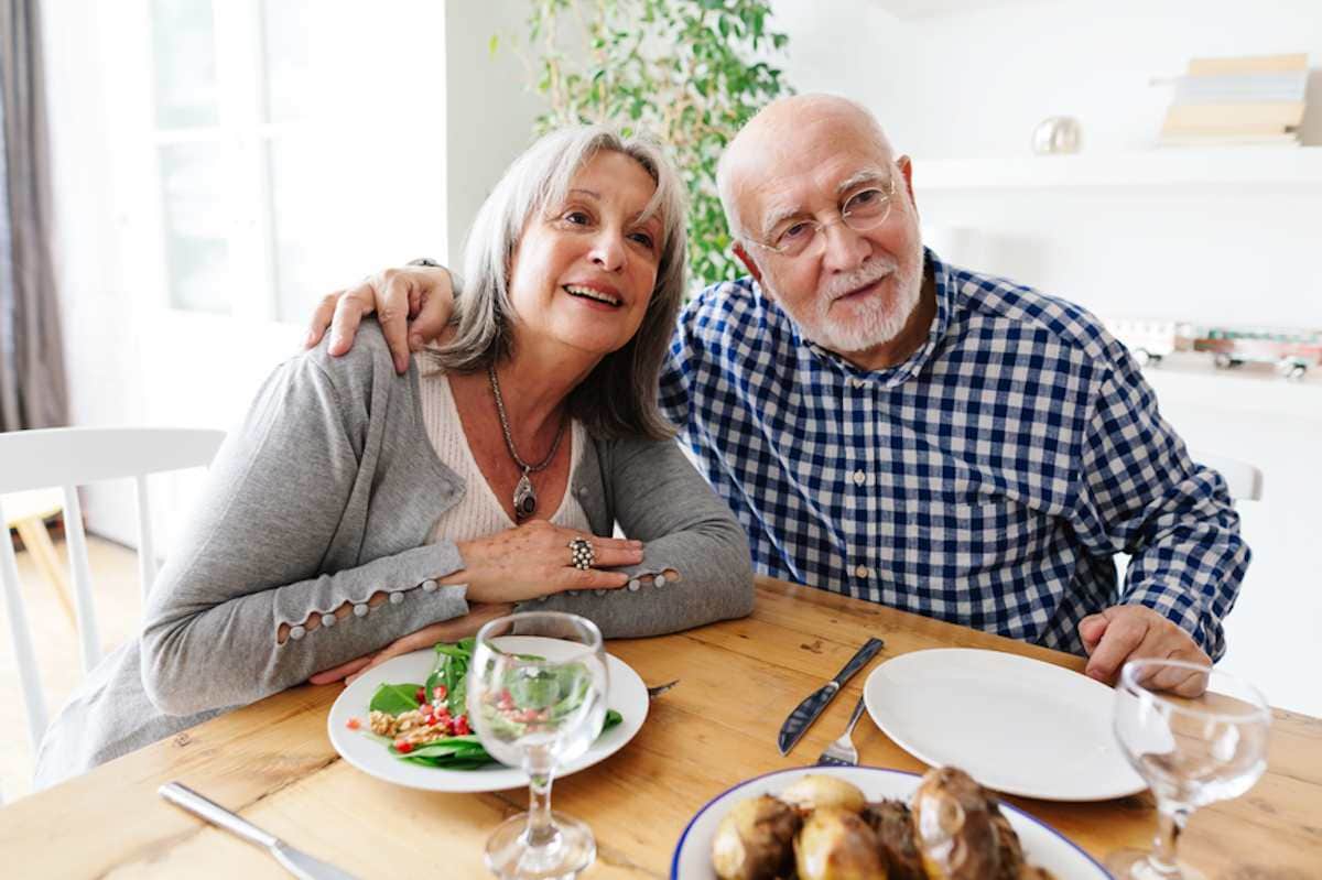 Senior couple dining at home