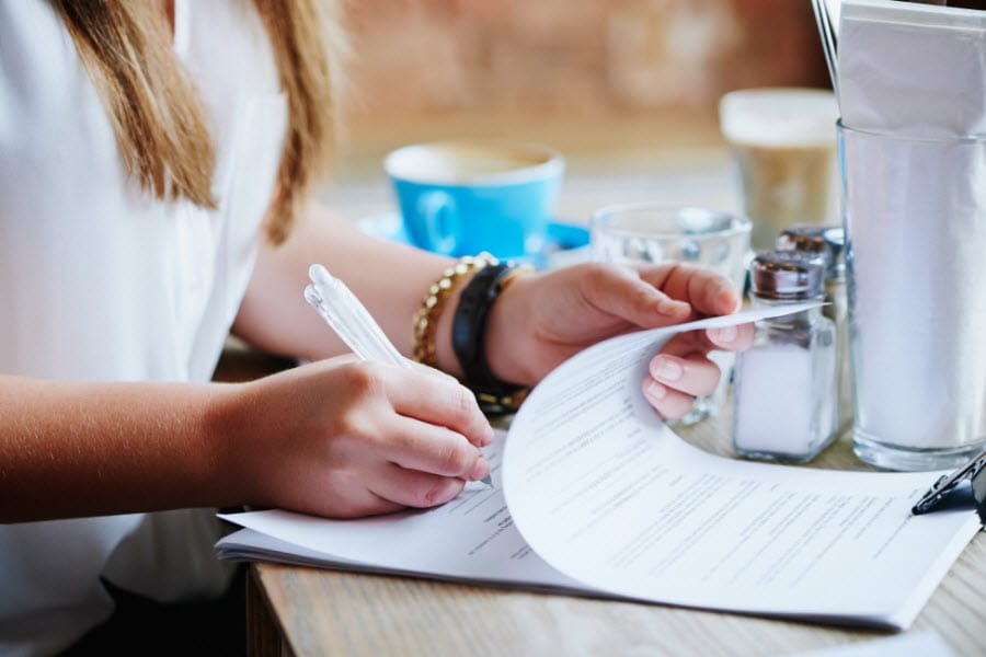 Woman signing a contract