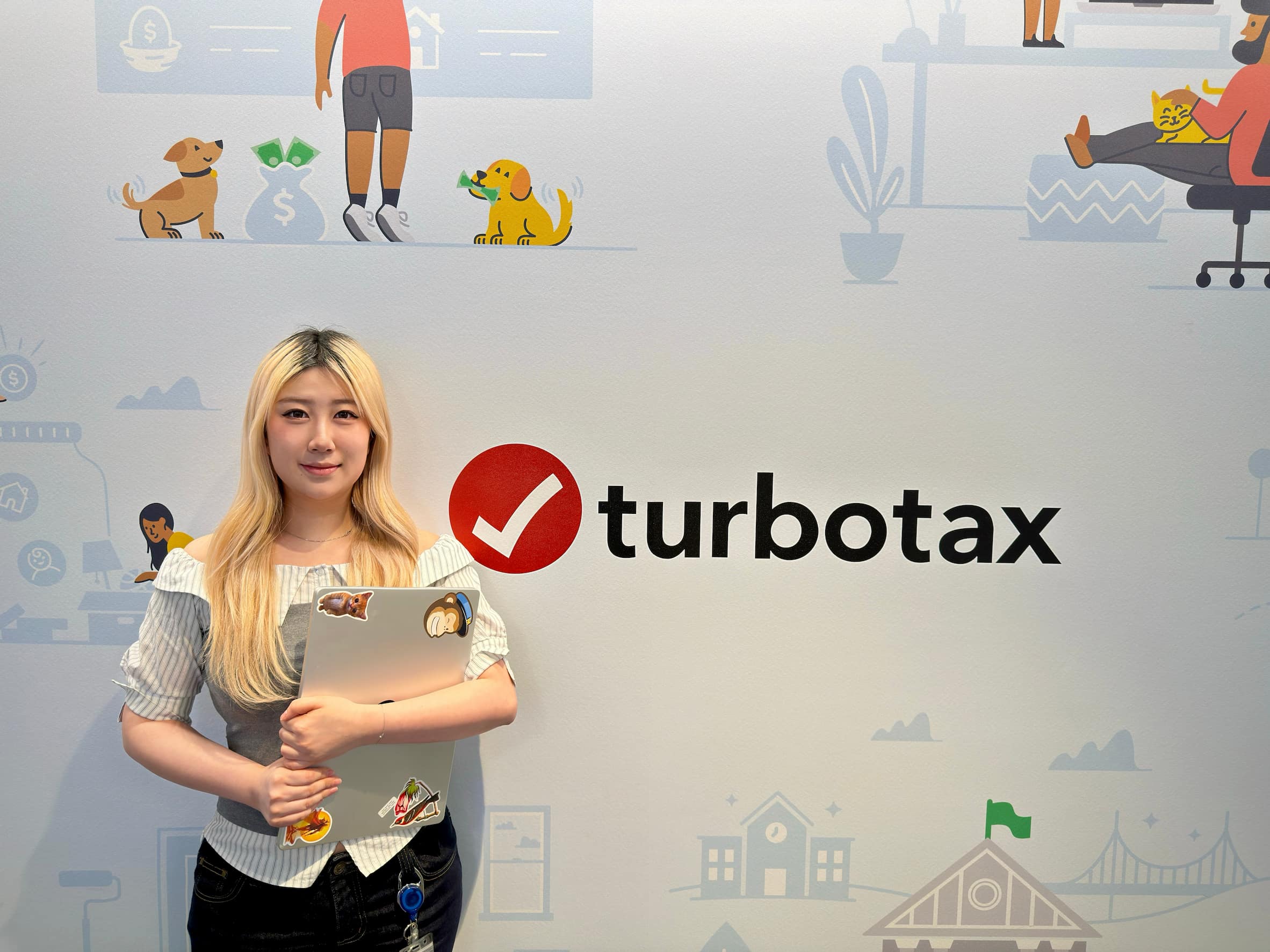 A person sitting on a couch using a laptop computer.