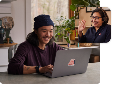 A young man working on his laptop in his home. Secondary image of Maria waving from her work space.