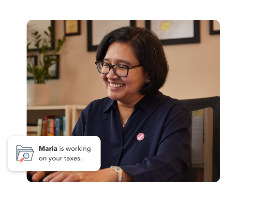 TurboTax expert, Maria on her laptop and the text “Maria is working on your taxes”.