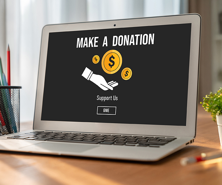 A crowd of people standing around each other holding up cell phones.