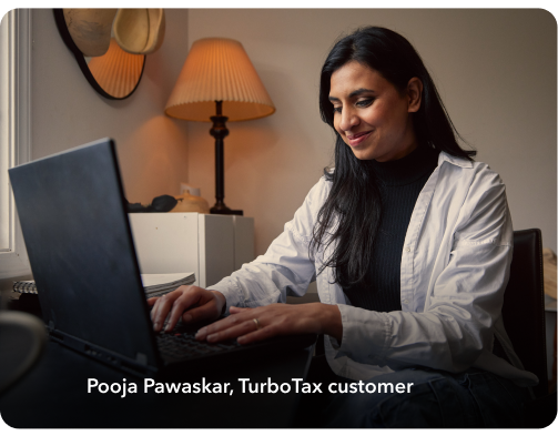 Pooja Pawaskar, a TurboTax customer working on a laptop in their home setting.