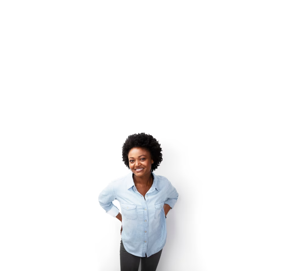 A person standing in front of a wall with a white umbrella.