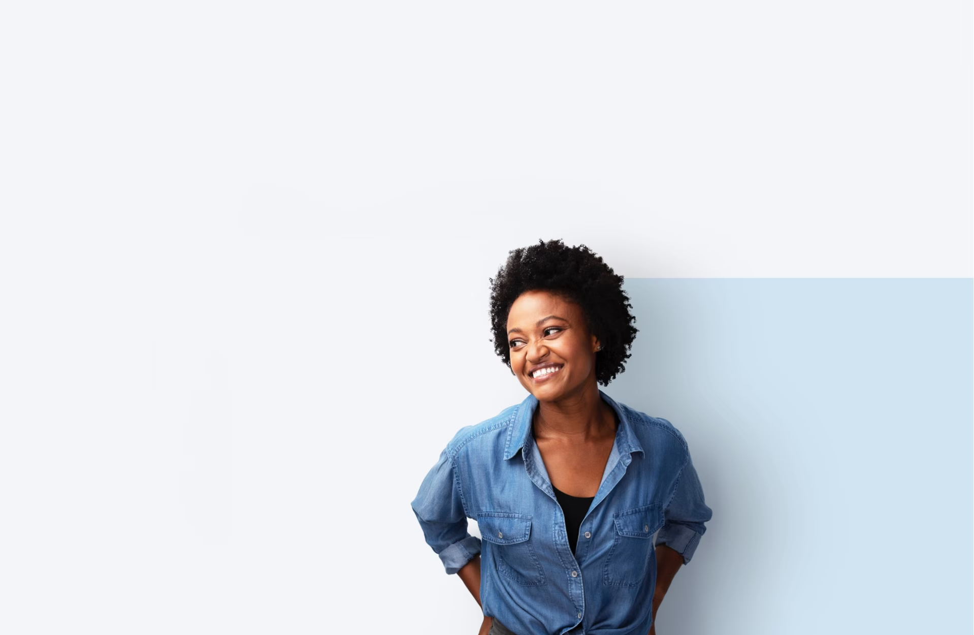 A young woman smiling warmly.