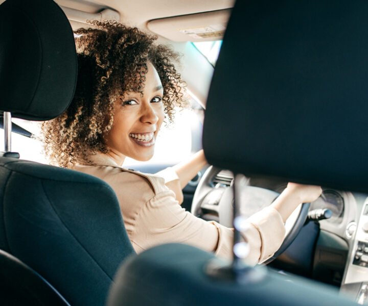 A person is sitting in a car.