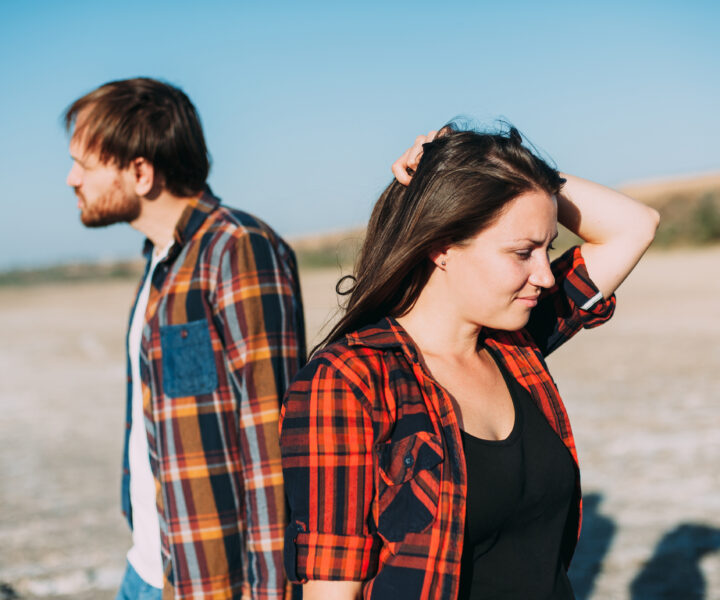 Man and woman looking in opposite directions