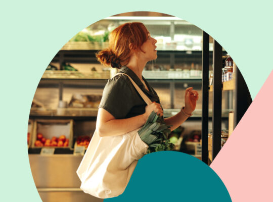 A person standing in front of a table with a basket of food.