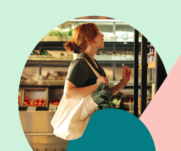 A person standing in front of a table with a basket of food.