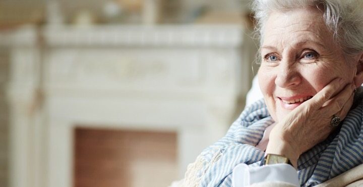 An elderly woman with a smile.