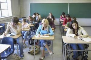 A classroom full of students is sitting at their desks.