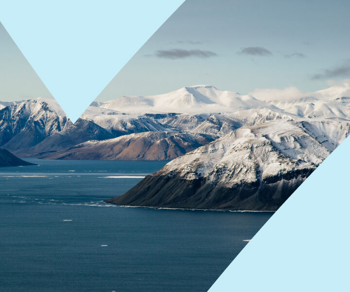 A large body of water surrounded by mountains.