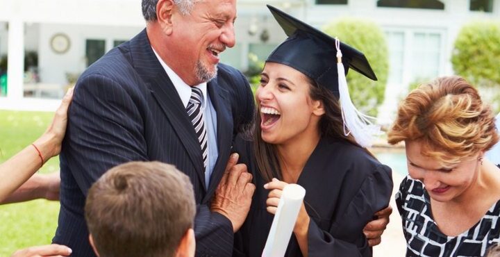 A person and a person are hugging and smiling.