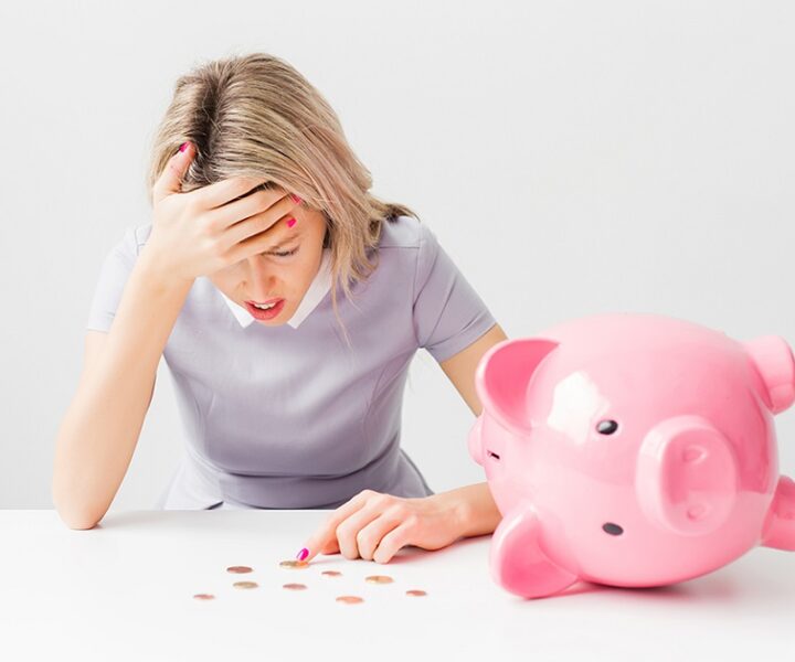 A person is counting coins from a piggy bank.