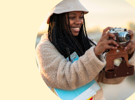 A person holding a camera.