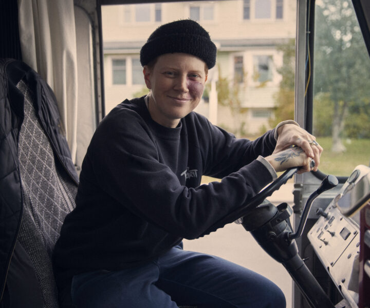 A person is sitting in driver’s seat