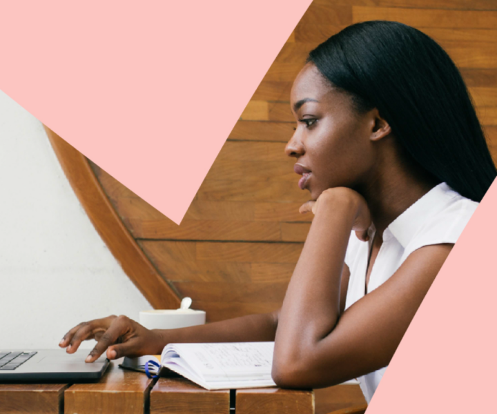 A person sitting at a desk with a laptop.