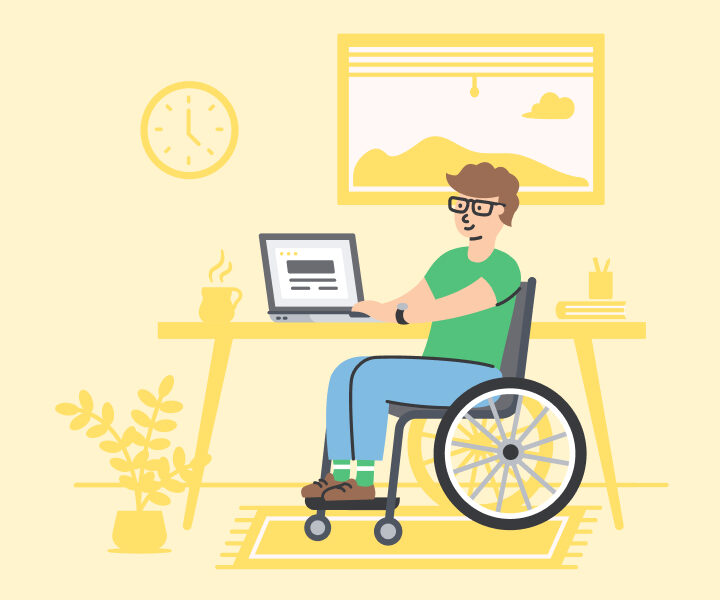 A person sitting on a wheel chair with a laptop.