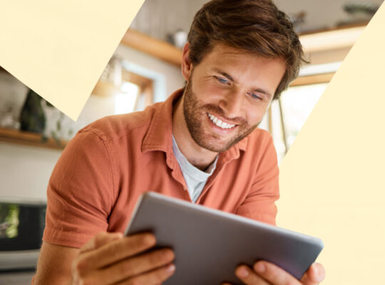 A person with a laptop in his hands.