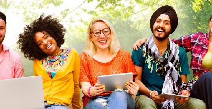 A group of people smiling together.