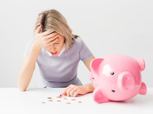 A person is counting coins from a piggy bank.