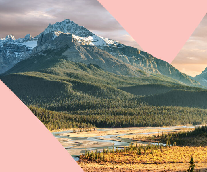 A scenic view of a mountain range with a river in the background.