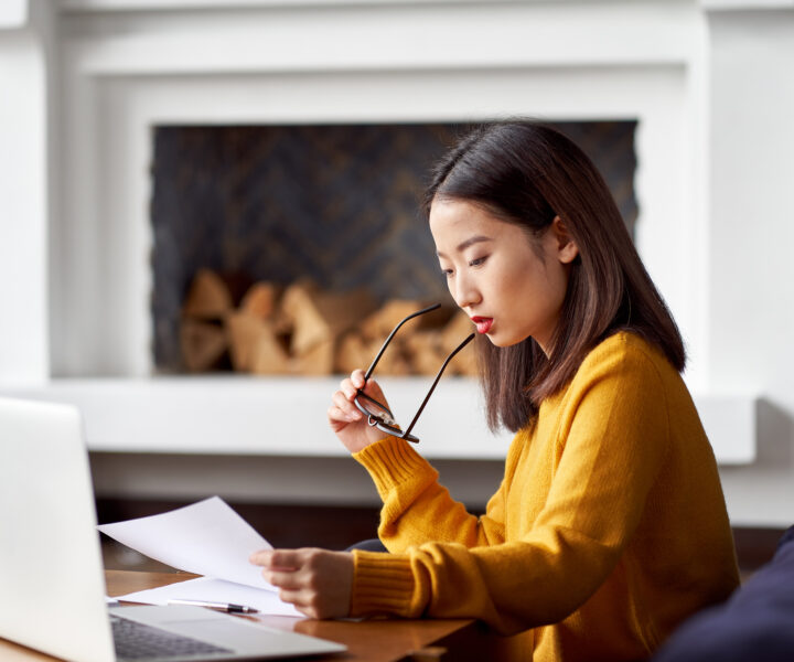 A woman looking at documents.