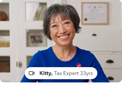 Kitty, Tax Expert, of 33 years experience is smiling 