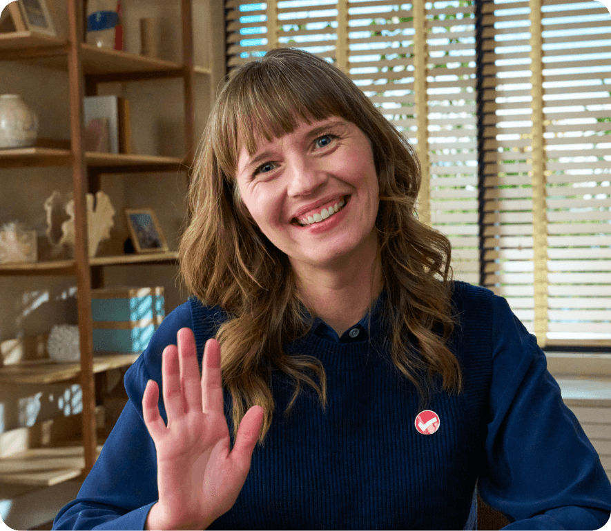 TurboTax expert waving and smiling