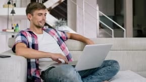 A person working on a laptop.