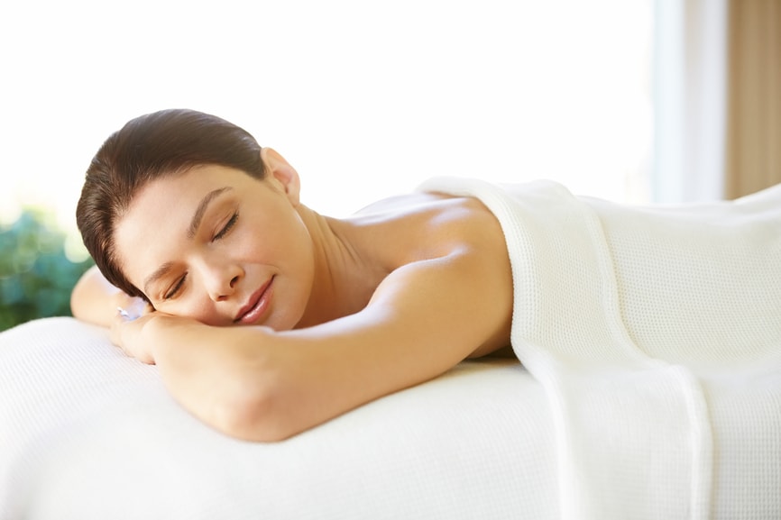 Laying on a massage table