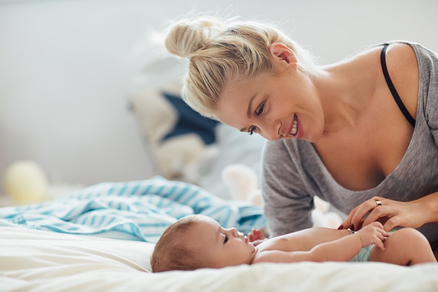 Mother playing with her baby