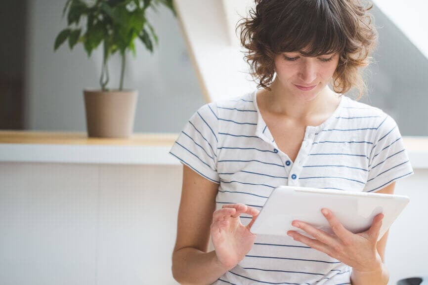 young woman using digital tablet