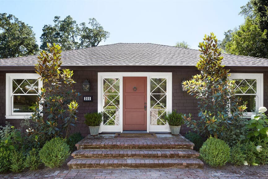 Single level residential home with brick entry stairs