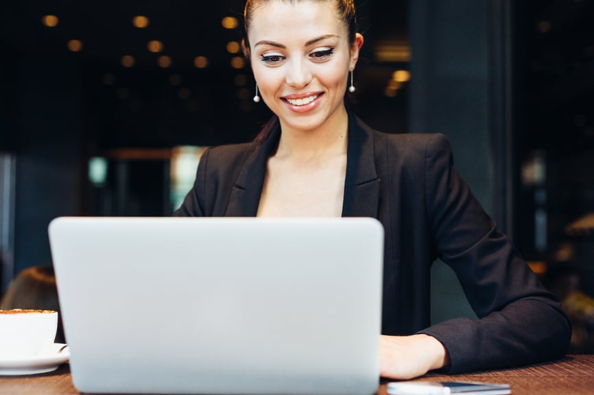 Professional business woman using laptop