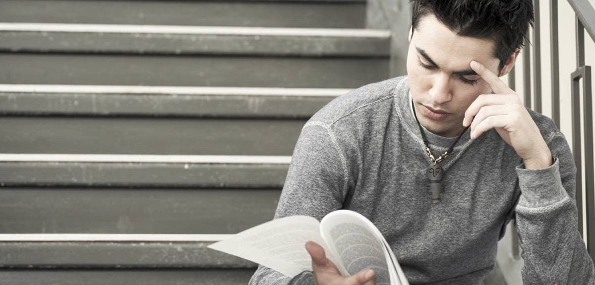 young man studying forms