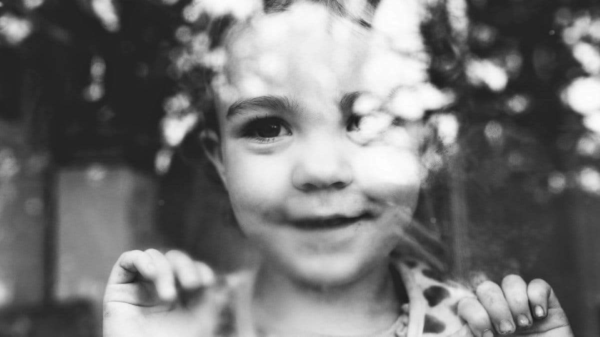 child looking out a window