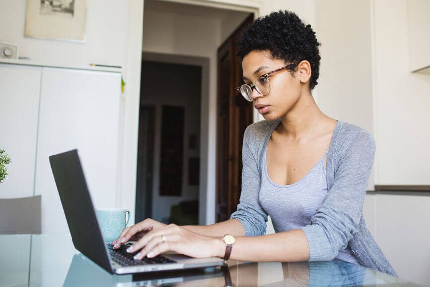 african american woman working on her laptop