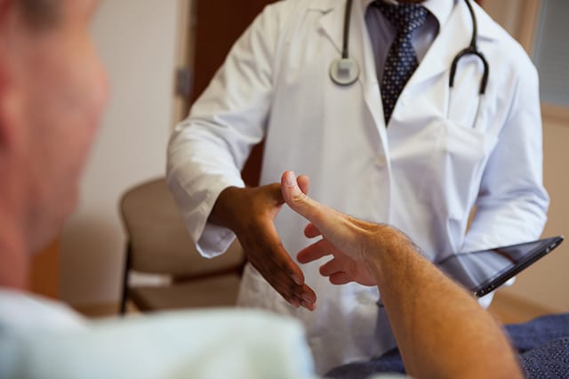 Doctor shaking the hand of a patient
