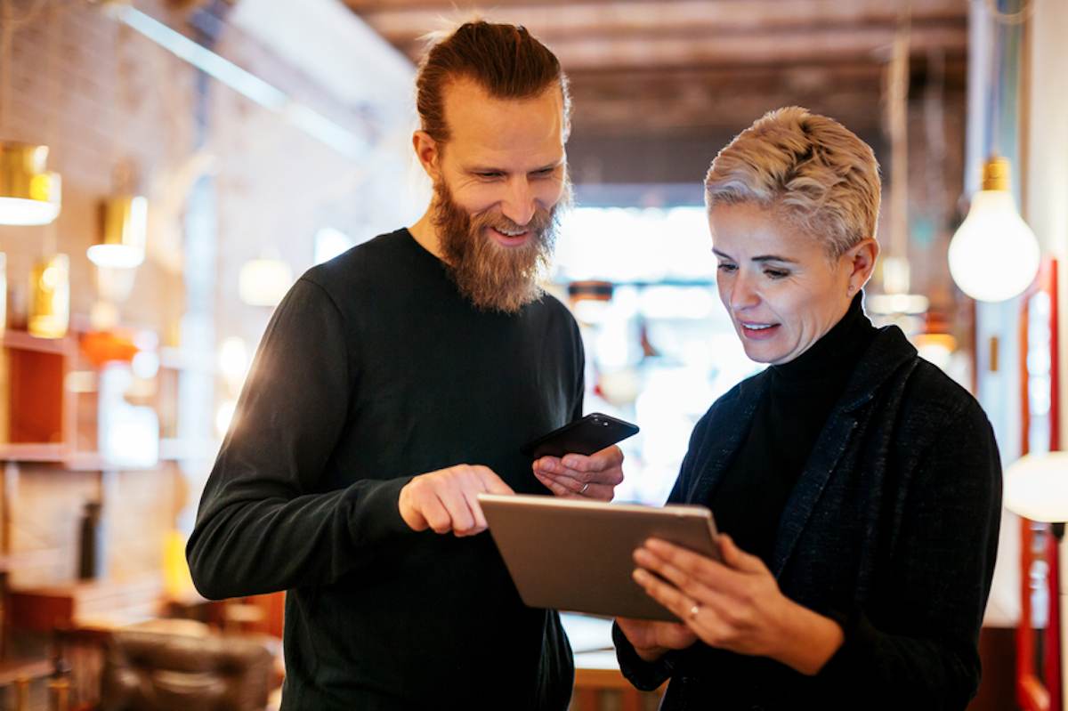 Man and woman work together in a vintage furniture store