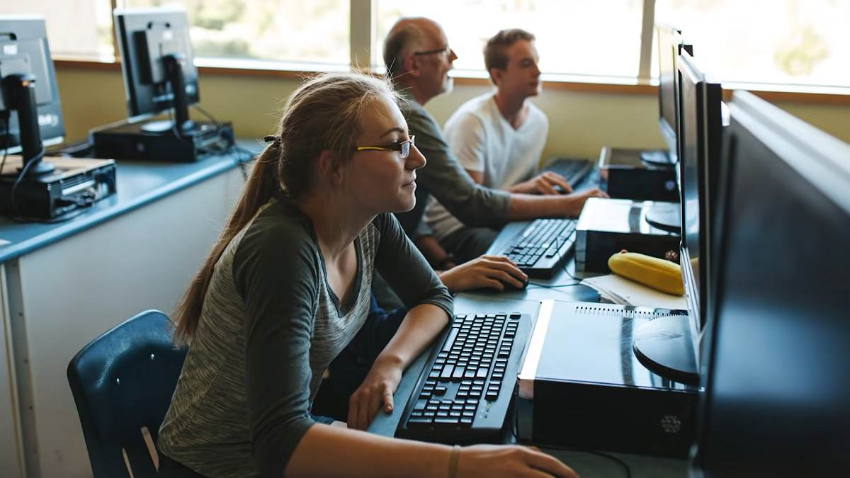 students working on computers in classroom